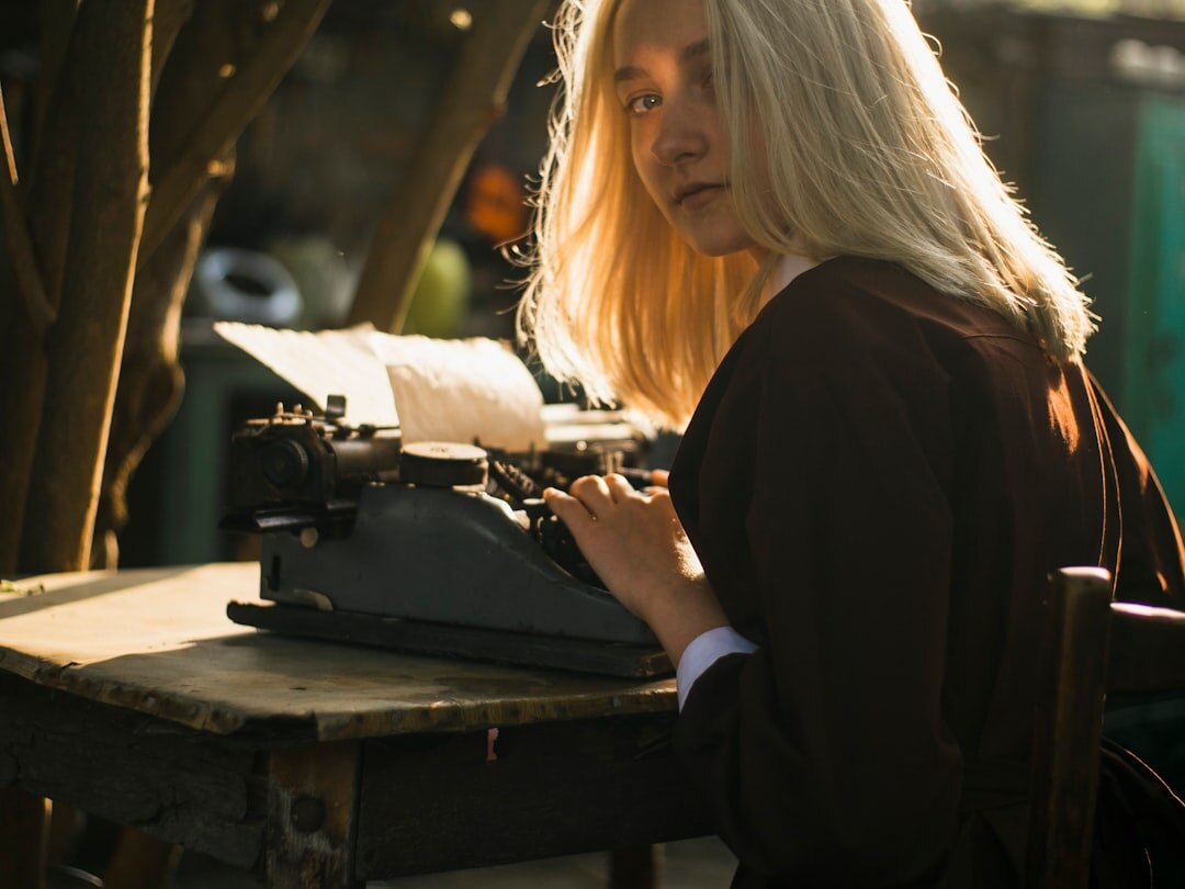 writer typing on old typewriter